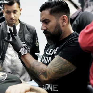 Tattoo Artist using gorilla gloves